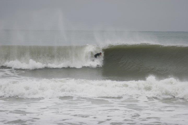 Wairarapa barrel (hollow wave). James Whitaker surfing