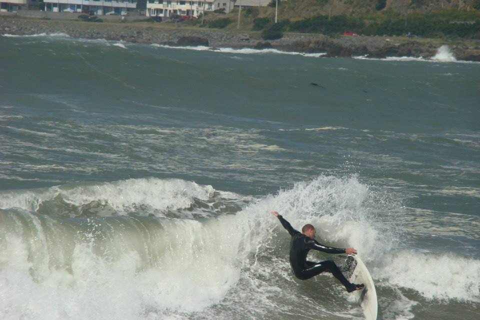 Surfboard fins out on small day (James Whitaker surfing)