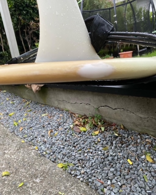 Repaired longboard surfboard