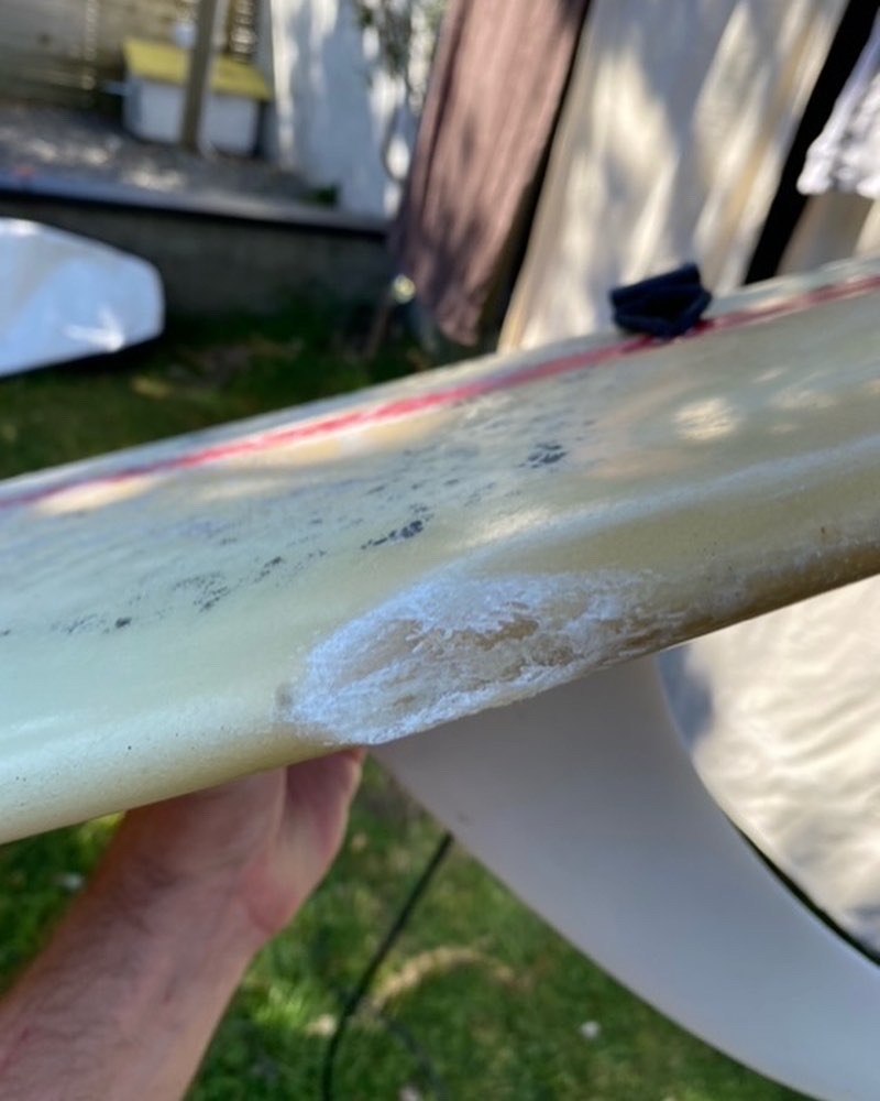Damaged longboard surfboard